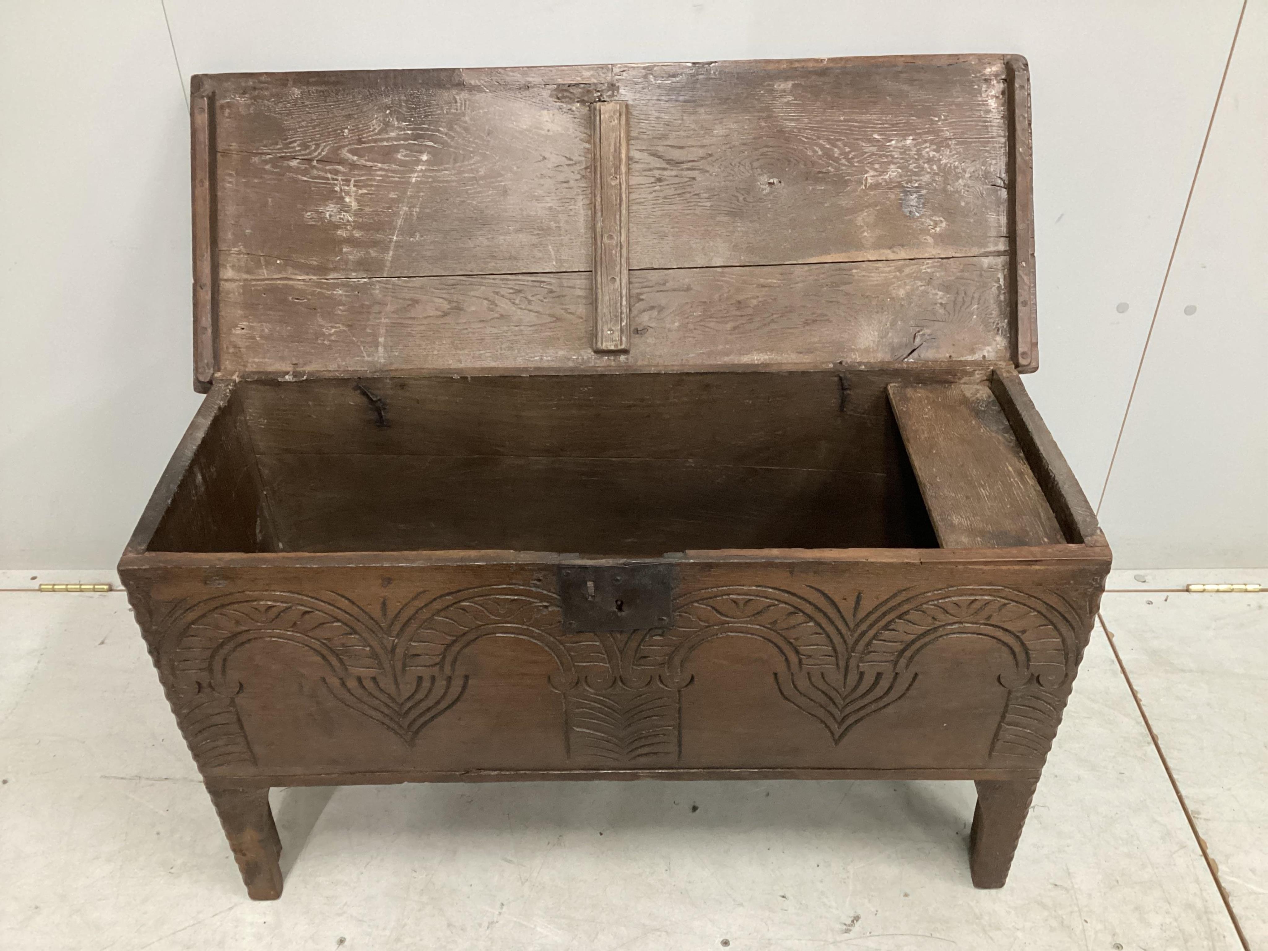 A small 17th century carved oak six plank coffer, width 96cm, depth 37cm, height 54cm. Condition - fair